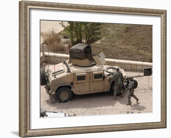 US Military Soldiers Take a Well Earned Break in the Forground of the Baghdad Hotel-Stocktrek Images-Framed Photographic Print