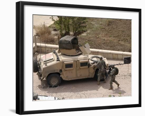 US Military Soldiers Take a Well Earned Break in the Forground of the Baghdad Hotel-Stocktrek Images-Framed Photographic Print