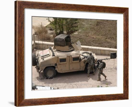 US Military Soldiers Take a Well Earned Break in the Forground of the Baghdad Hotel-Stocktrek Images-Framed Photographic Print