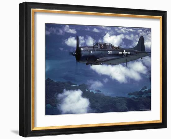 US Navy SBD Dauntless in Flight During Palau Islands Air Raid Attack-J^ R^ Eyerman-Framed Photographic Print