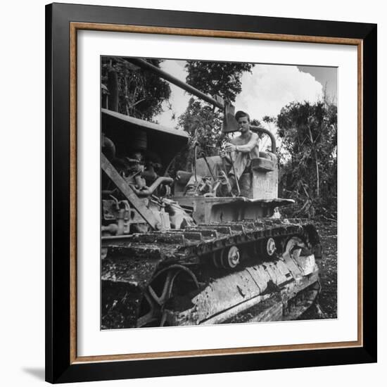 US Navy Seabee Robert H. Sellers of Eugene, or Operating a Caterpiller-J^ R^ Eyerman-Framed Photographic Print