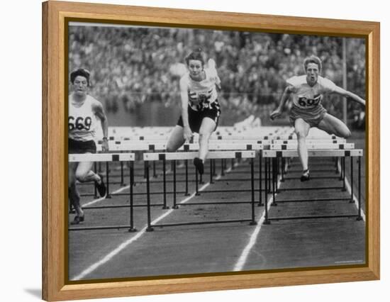 US Runner Fanny Blankers Koen Setting Olympic Record of 11.2 Seconds in 80 Meter Hurdles-Mark Kauffman-Framed Premier Image Canvas