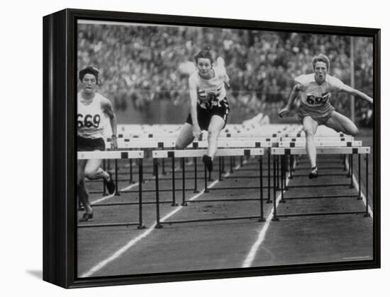 US Runner Fanny Blankers Koen Setting Olympic Record of 11.2 Seconds in 80 Meter Hurdles-Mark Kauffman-Framed Premier Image Canvas