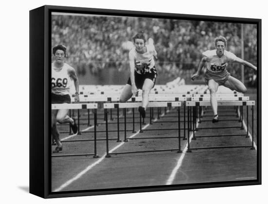 US Runner Fanny Blankers Koen Setting Olympic Record of 11.2 Seconds in 80 Meter Hurdles-Mark Kauffman-Framed Premier Image Canvas