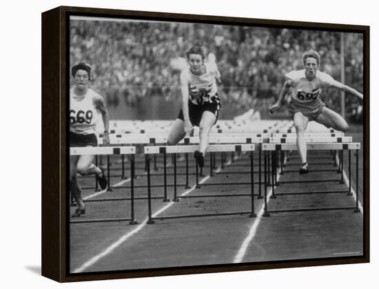 US Runner Fanny Blankers Koen Setting Olympic Record of 11.2 Seconds in 80 Meter Hurdles-Mark Kauffman-Framed Premier Image Canvas