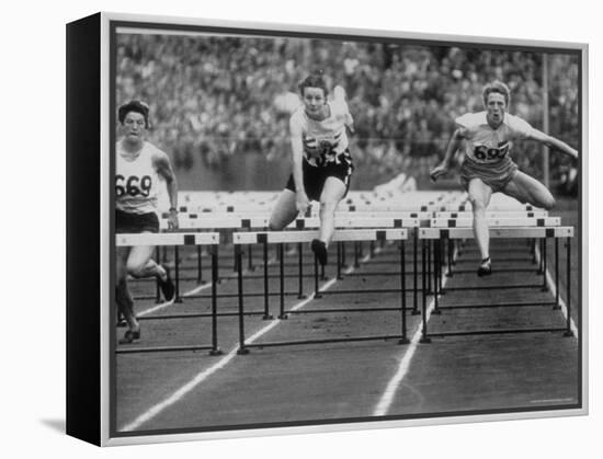 US Runner Fanny Blankers Koen Setting Olympic Record of 11.2 Seconds in 80 Meter Hurdles-Mark Kauffman-Framed Premier Image Canvas