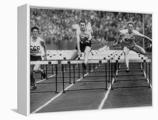 US Runner Fanny Blankers Koen Setting Olympic Record of 11.2 Seconds in 80 Meter Hurdles-Mark Kauffman-Framed Premier Image Canvas