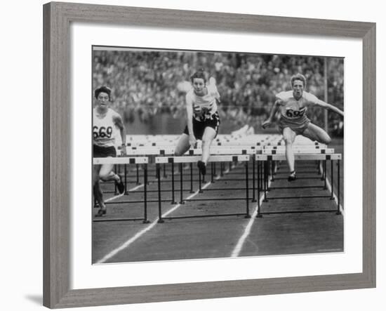 US Runner Fanny Blankers Koen Setting Olympic Record of 11.2 Seconds in 80 Meter Hurdles-Mark Kauffman-Framed Premium Photographic Print