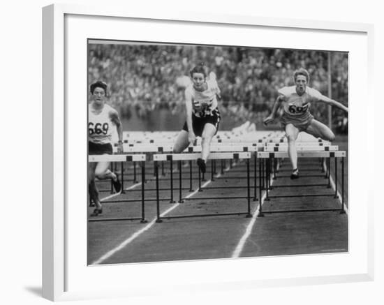 US Runner Fanny Blankers Koen Setting Olympic Record of 11.2 Seconds in 80 Meter Hurdles-Mark Kauffman-Framed Premium Photographic Print