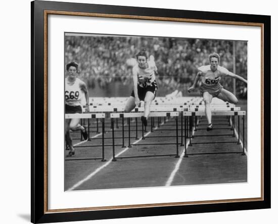 US Runner Fanny Blankers Koen Setting Olympic Record of 11.2 Seconds in 80 Meter Hurdles-Mark Kauffman-Framed Premium Photographic Print