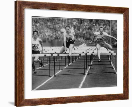 US Runner Fanny Blankers Koen Setting Olympic Record of 11.2 Seconds in 80 Meter Hurdles-Mark Kauffman-Framed Premium Photographic Print