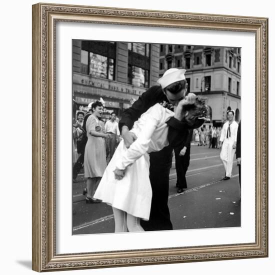 US Sailor Bending Young Nurse over His Arm to Give Her Passionate Kiss in Middle of Times Square-Victor Jorgensen-Framed Photographic Print