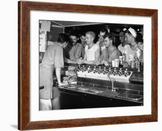 US Sailors Crowding around the Soda Fountain Aboard a Battleship-Carl Mydans-Framed Premium Photographic Print