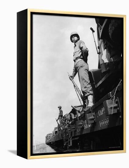 US Soldiers Standing Guard on a Troop Train-Myron Davis-Framed Premier Image Canvas