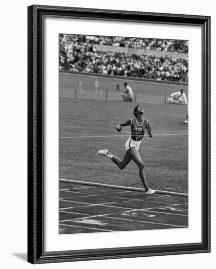 US Sprinter, Wilma Rudolph, Winning Women's 100 Meter Dash in Olympics-George Silk-Framed Premium Photographic Print