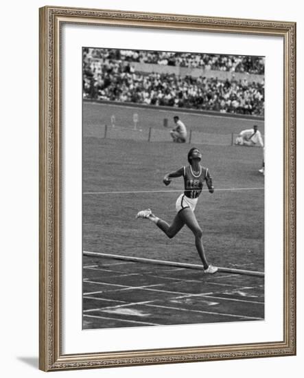 US Sprinter, Wilma Rudolph, Winning Women's 100 Meter Dash in Olympics-George Silk-Framed Premium Photographic Print