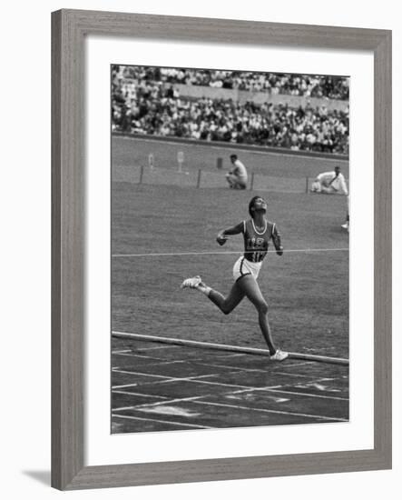 US Sprinter, Wilma Rudolph, Winning Women's 100 Meter Dash in Olympics-George Silk-Framed Premium Photographic Print