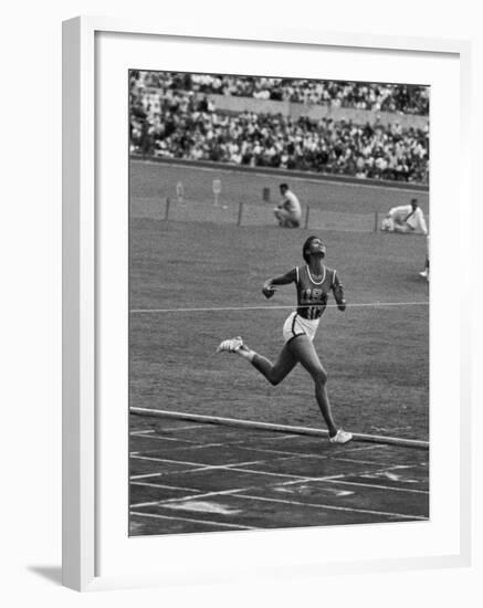 US Sprinter, Wilma Rudolph, Winning Women's 100 Meter Dash in Olympics-George Silk-Framed Premium Photographic Print