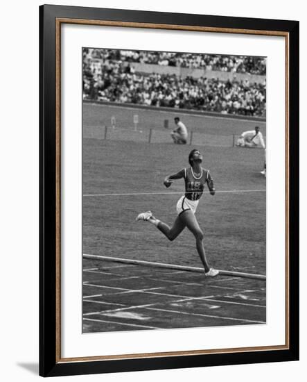 US Sprinter, Wilma Rudolph, Winning Women's 100 Meter Dash in Olympics-George Silk-Framed Premium Photographic Print