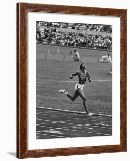 US Sprinter, Wilma Rudolph, Winning Women's 100 Meter Dash in Olympics-George Silk-Framed Premium Photographic Print