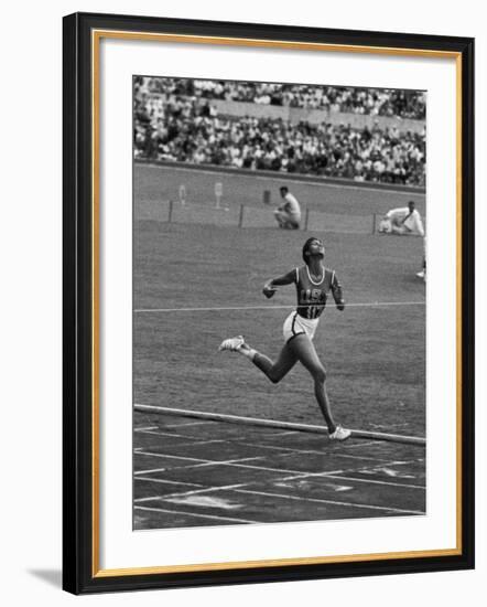 US Sprinter, Wilma Rudolph, Winning Women's 100 Meter Dash in Olympics-George Silk-Framed Premium Photographic Print