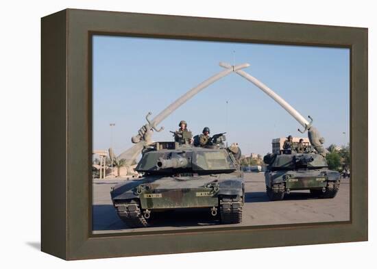US Tanks Drive under the 'Hands of Victory' in Baghdad, Iraq, Ca. 2003-null-Framed Stretched Canvas