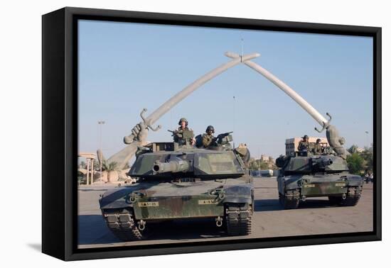 US Tanks Drive under the 'Hands of Victory' in Baghdad, Iraq, Ca. 2003-null-Framed Stretched Canvas