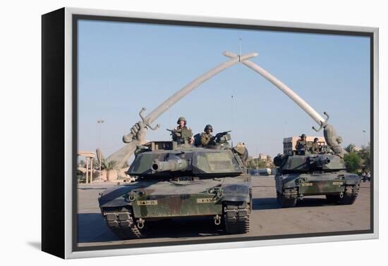 US Tanks Drive under the 'Hands of Victory' in Baghdad, Iraq, Ca. 2003-null-Framed Stretched Canvas