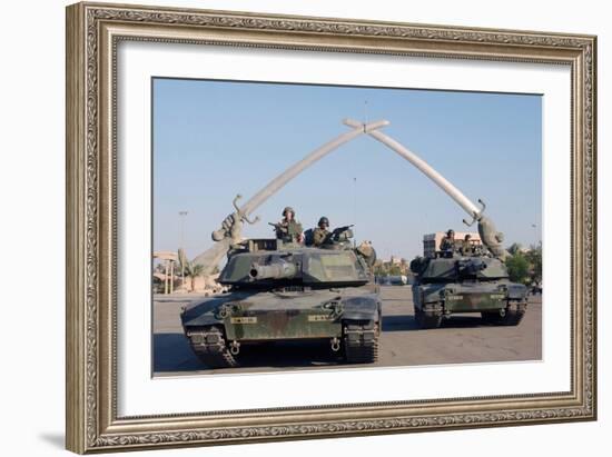 US Tanks Drive under the 'Hands of Victory' in Baghdad, Iraq, Ca. 2003-null-Framed Photo