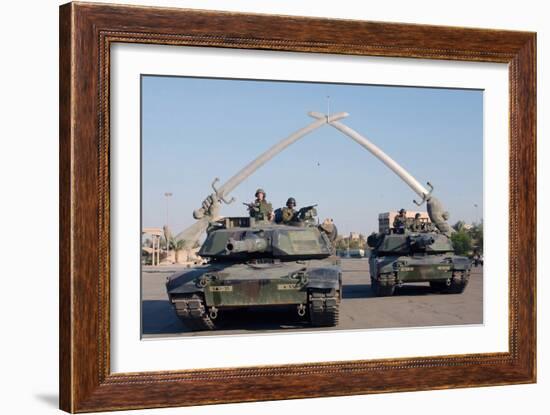 US Tanks Drive under the 'Hands of Victory' in Baghdad, Iraq, Ca. 2003-null-Framed Photo