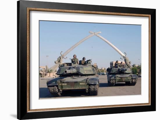 US Tanks Drive under the 'Hands of Victory' in Baghdad, Iraq, Ca. 2003-null-Framed Photo