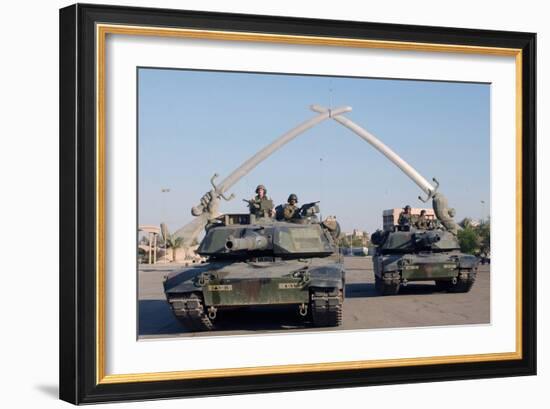 US Tanks Drive under the 'Hands of Victory' in Baghdad, Iraq, Ca. 2003-null-Framed Photo