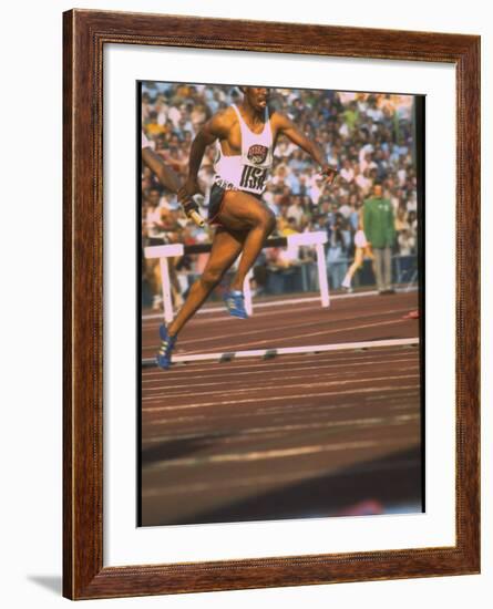 US Track Athlete Eddie Hart Running the 400 Meter Relay at the Summer Olympics-null-Framed Premium Photographic Print