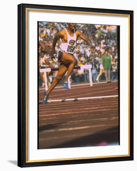 US Track Athlete Eddie Hart Running the 400 Meter Relay at the Summer Olympics-null-Framed Premium Photographic Print