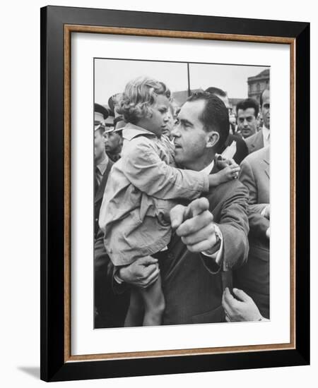 US Vice-President Richard M. Nixon Holding a Little Polish Girl-null-Framed Photographic Print