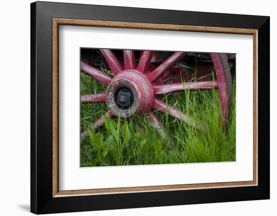 USA, Alaska, Chena Hot Springs. Vintage wagon wheel and grass.-Jaynes Gallery-Framed Photographic Print