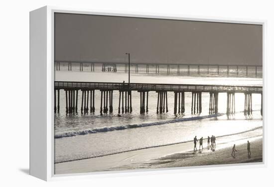USA, California, Avila Beach. Silhouetted Beach Walkers Approach Pier End of Day-Trish Drury-Framed Premier Image Canvas