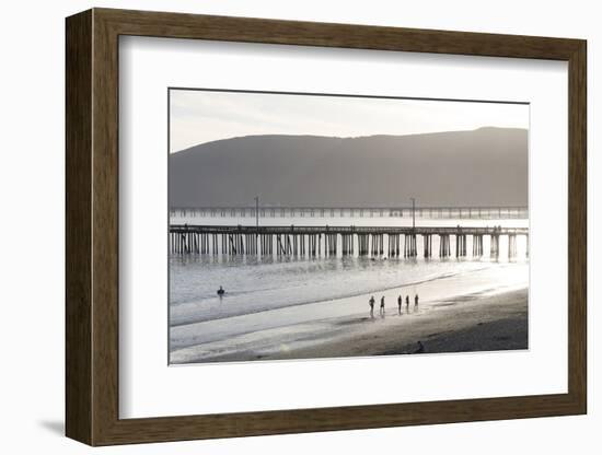 USA, California, Avila Beach. Silhouetted Beach Walkers Approach Pier End of Day-Trish Drury-Framed Photographic Print