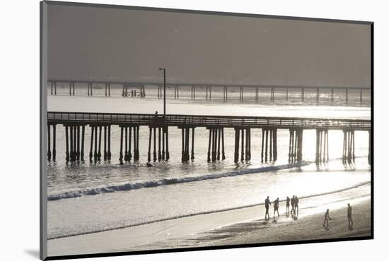 USA, California, Avila Beach. Silhouetted Beach Walkers Approach Pier End of Day-Trish Drury-Mounted Photographic Print