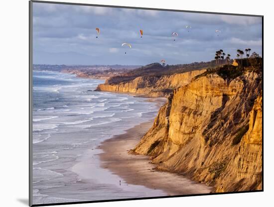 USA, California, La Jolla. Paragliders Float over Black's Beach in Late Afternoon-Ann Collins-Mounted Photographic Print