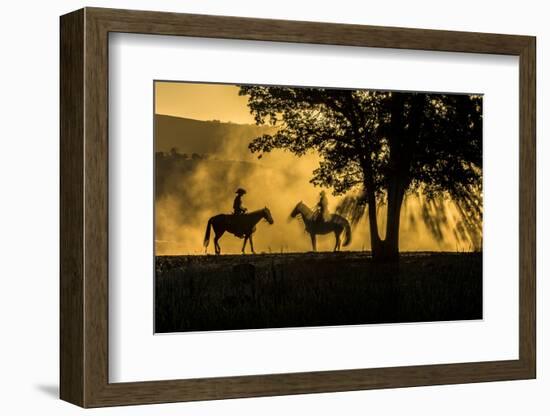 USA, California, Parkfield, V6 Ranch silhouette of two riders on horseback. Early dusty morning.-Ellen Clark-Framed Photographic Print
