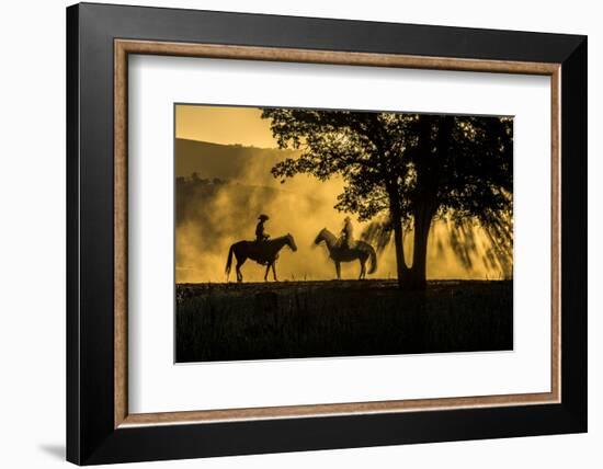 USA, California, Parkfield, V6 Ranch silhouette of two riders on horseback. Early dusty morning.-Ellen Clark-Framed Photographic Print