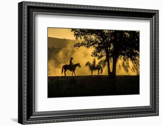 USA, California, Parkfield, V6 Ranch silhouette of two riders on horseback. Early dusty morning.-Ellen Clark-Framed Photographic Print