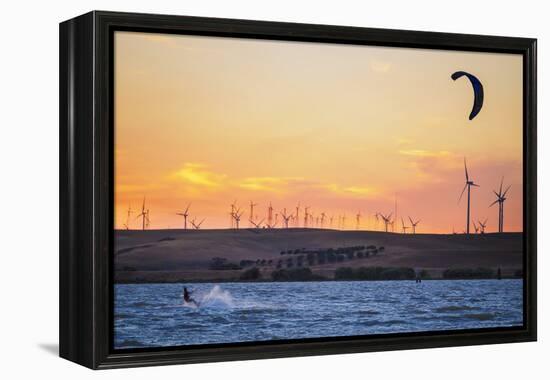 Usa, California, Rio Vista. Kiteboarder at sunset with wind farm turbines.-Merrill Images-Framed Premier Image Canvas