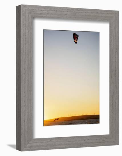 USA, California, Rio Vista, Sacramento River Delta. Kiteboarder catching air at sunset.-Merrill Images-Framed Photographic Print