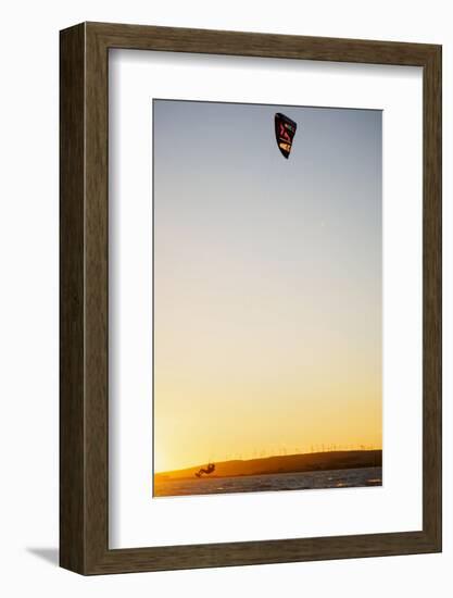 USA, California, Rio Vista, Sacramento River Delta. Kiteboarder catching air at sunset.-Merrill Images-Framed Photographic Print