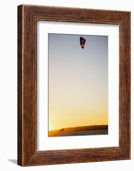 USA, California, Rio Vista, Sacramento River Delta. Kiteboarder catching air at sunset.-Merrill Images-Framed Photographic Print