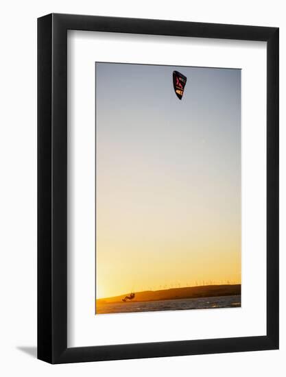 USA, California, Rio Vista, Sacramento River Delta. Kiteboarder catching air at sunset.-Merrill Images-Framed Photographic Print