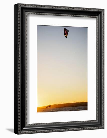 USA, California, Rio Vista, Sacramento River Delta. Kiteboarder catching air at sunset.-Merrill Images-Framed Photographic Print