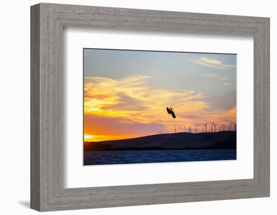 USA, California, Rio Vista, Sacramento River Delta. Kiteboarder catching air at sunset.-Merrill Images-Framed Photographic Print